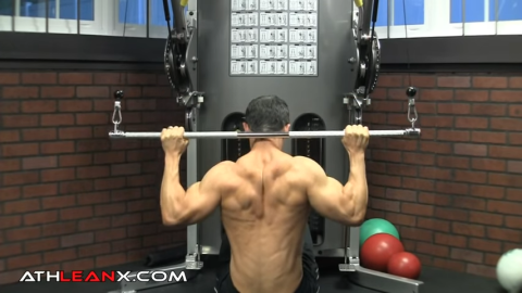 going behind the head in the lat pulldown