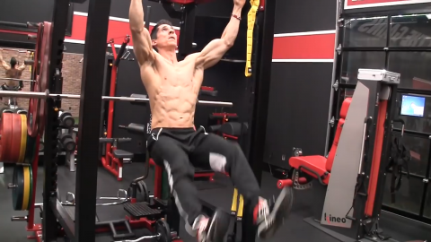 adduction of legs in hanging x raise abs exercise