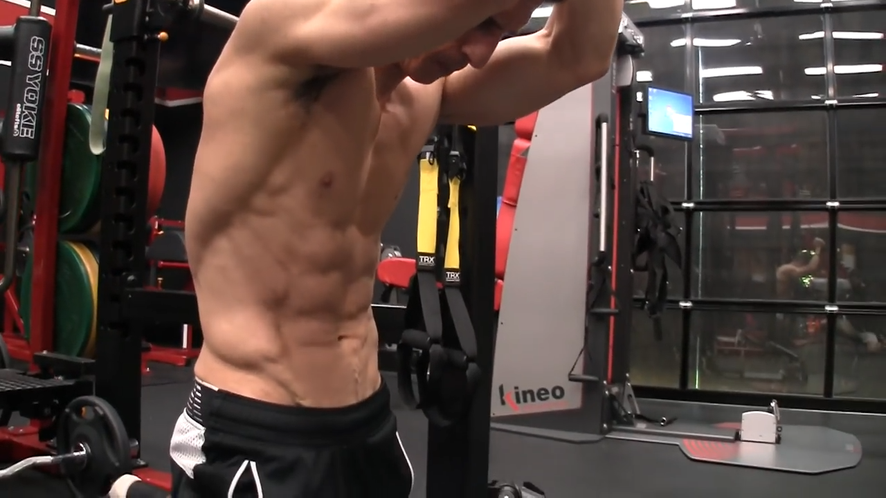 brace your abs before the banded pull down