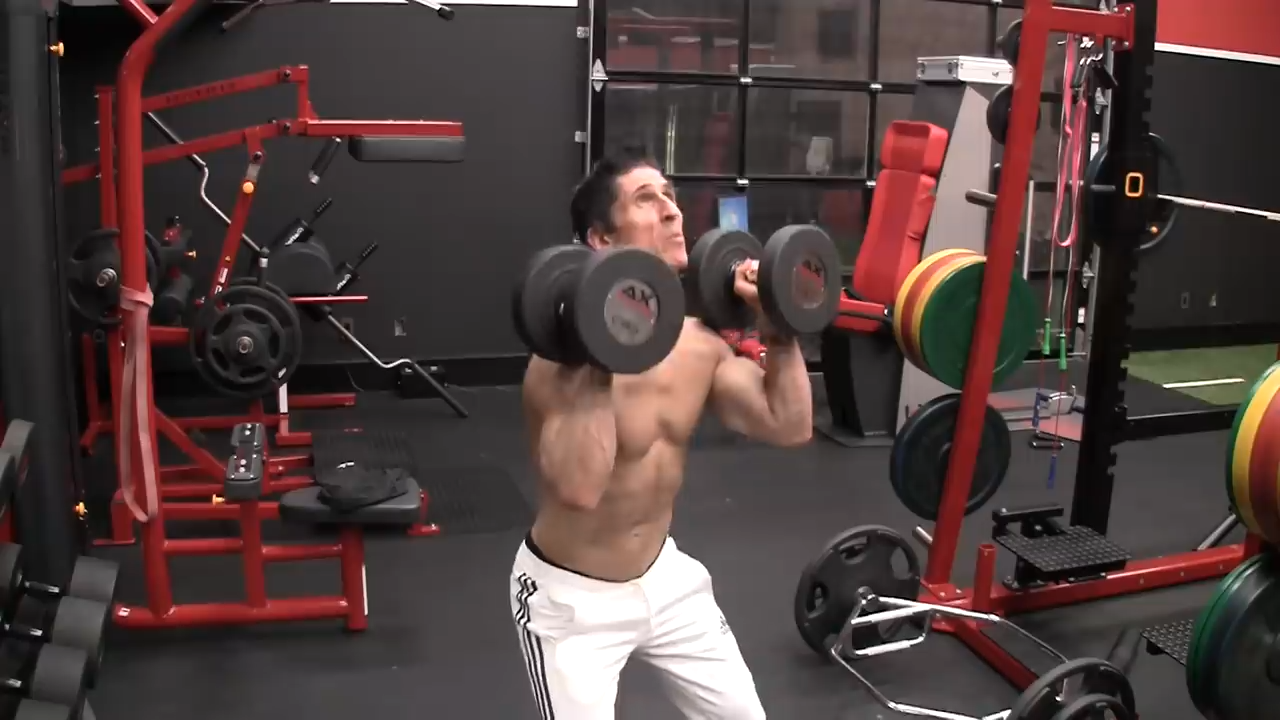 bend your knees and load the hips in the dumbbell push press for shoulders