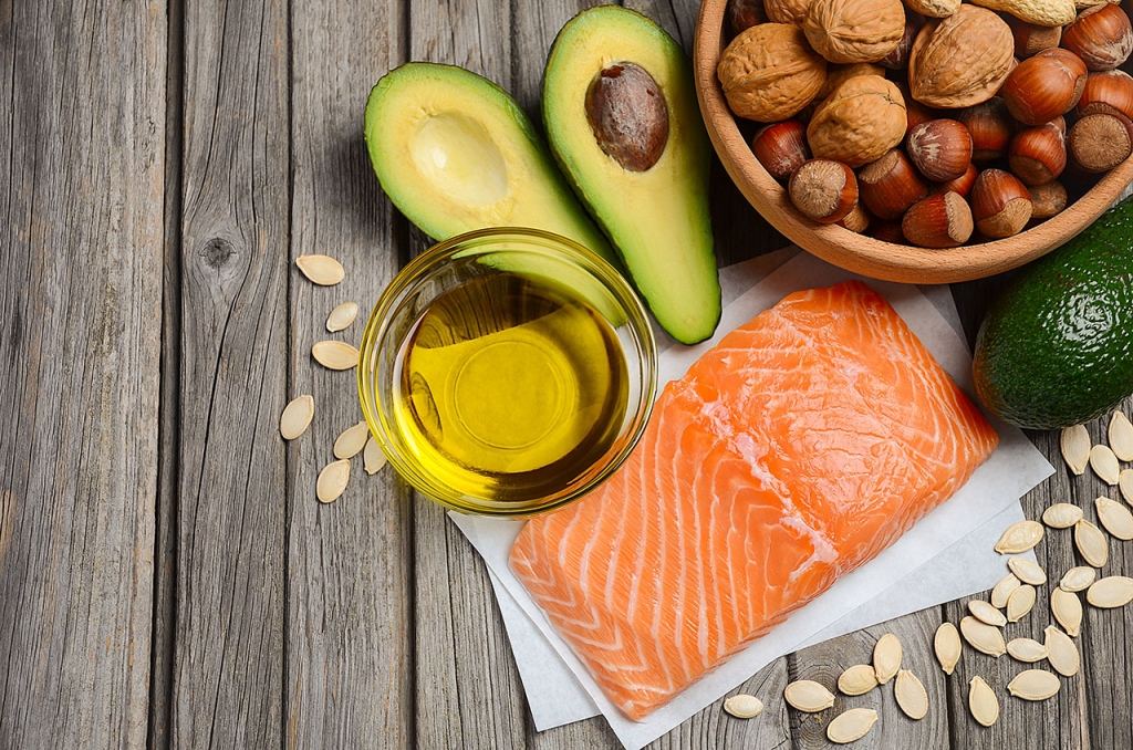 healthy fats including salmon, nuts, seeds, avocado, olive oil