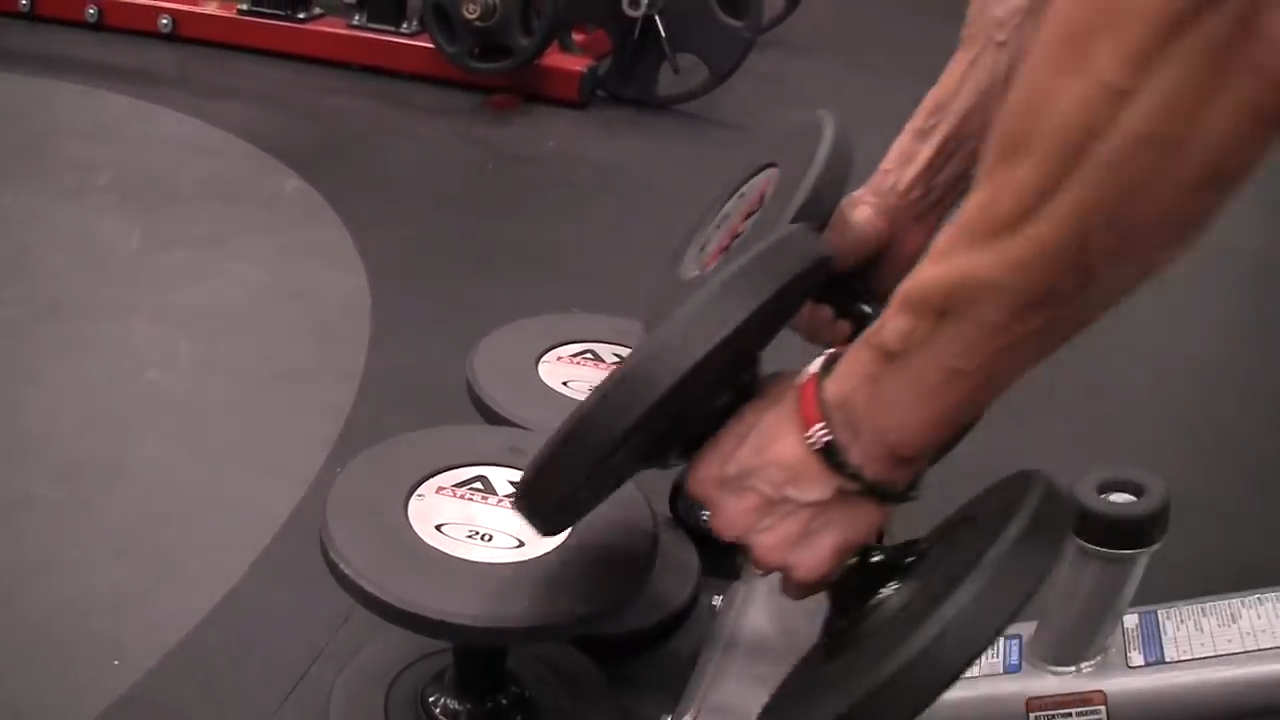 a set of dumbbells is placed on the ground for dumbbell touch rows