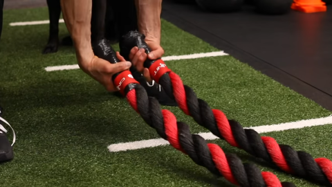 grabbing battle ropes with an underhand grip
